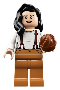 Lego minifigure of Monica from FRIENDS holding a cake.